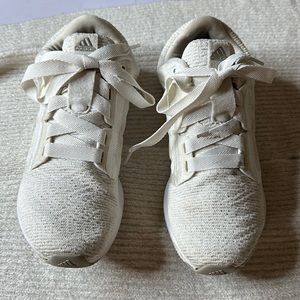 Nice adidas women’s gym shoes in white with iridescent stripes on both sides.